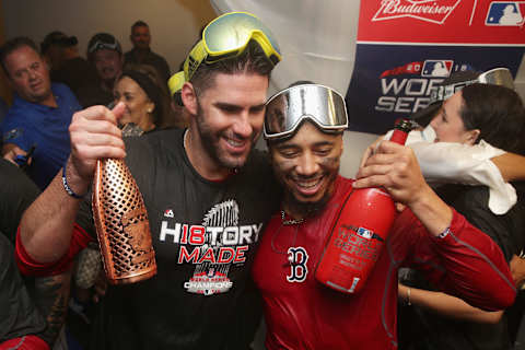 LOS ANGELES, CA – OCTOBER 28: J.D. Martinez #28 and Mookie Betts #50 of the Boston Red Sox celebrate with the world series after his team’s 5-1 win over the Los Angeles Dodgers in Game Five of the 2018 World Series at Dodger Stadium on October 28, 2018 in Los Angeles, California. (Photo by Sean M. Haffey/Getty Images)