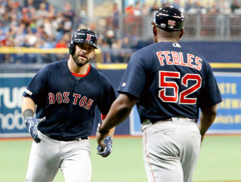 ST. PETERSBURG, FL – APRIL 19: Mitch Moreland #18 of the Boston Red Sox gets a handshake from third base coach Carlos Febles #52 after hitting a solo home run during the top of the eighth inning of their game against the Tampa Bay Rays at Tropicana Field on April 19, 2019 in St. Petersburg, Florida. (Photo by Joseph Garnett Jr. /Getty Images)