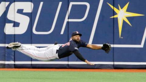 ST. PETERSBURG, FL – APRIL 19: Jackie Bradley Jr. #19 of the Boston Red Sox goes airborne to try stop a ball hit to the outfield during the bottom of the second inning of the game against the Tampa Bay Rays at Tropicana Field on April 19, 2019 in St. Petersburg, Florida. (Photo by Joseph Garnett Jr. /Getty Images)