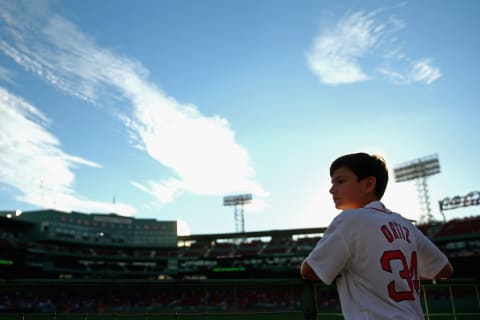 BOSTON, MA – AUGUST 30: A young fan looks out over the bullpen before the game between the Boston Red Sox and the Tampa Bay Rays at Fenway Park on August 30, 2016 in Boston, Massachusetts. (Photo by Maddie Meyer/Getty Images)