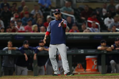 MINNEAPOLIS, MINNESOTA – JUNE 19: Manager Alex Cora #20 of the Boston Red Sox argues a call in the seventeenth inning against the Minnesota Twins at Target Field on June 19, 2018 in Minneapolis, Minnesota. The Minnesota Twins defeated the Boston Red Sox 4-3 in 17 innings.(Photo by Adam Bettcher/Getty Images)