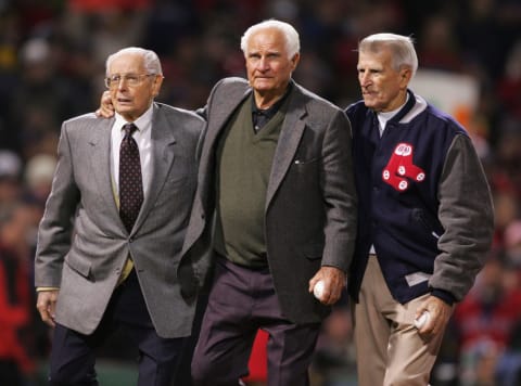 BOSTON – OCTOBER 24: (L-R) Boston Red Sox Hall of famers Dom Dimaggio, Bobby Doerr and Johnny Pesky walk out onto the field to throw the first pitch of game two of the World Series between the St. Louis Cardinals and the Boston Red Sox on October 24, 2004 at Fenway Park in Boston, Massachusetts. (Photo by Elsa/Getty Images)