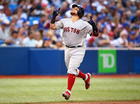 TORONTO, ON – JULY 03: Christian Vazquez #7 of the Boston Red Sox hits a home run in the fourth inning during a MLB game against the Toronto Blue Jays at Rogers Centre on July 03, 2019 in Toronto, Canada. (Photo by Vaughn Ridley/Getty Images)