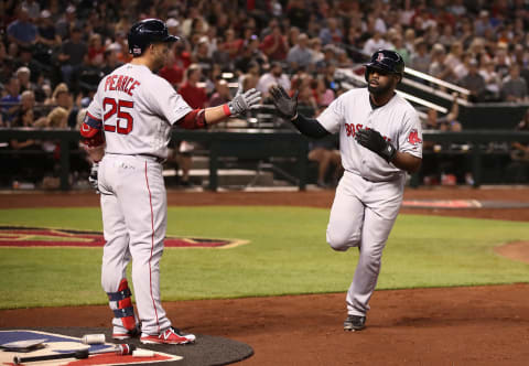 PHOENIX, ARIZONA – APRIL 06: Jackie Bradley Jr. #19 of the Boston Red Sox high fives Steve Pearce #25 after scoring against the Arizona Diamondbacks during the seventh inning of the MLB game at Chase Field on April 06, 2019 in Phoenix, Arizona. (Photo by Christian Petersen/Getty Images)