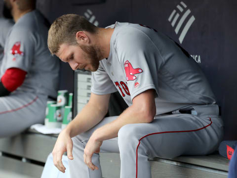 NEW YORK, NEW YORK – AUGUST 03: Chris Sale #41 of the Boston Red Sox sits in the dugout in the second inning as his team bats against the New York Yankees during game one of a double header at Yankee Stadium on August 03, 2019 in the Bronx borough of New York City. (Photo by Elsa/Getty Images)