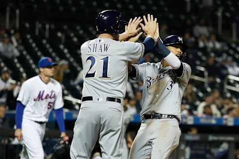 NEW YORK, NEW YORK – APRIL 26: Orlando Arcia #3 and Travis Shaw #21 of the Milwaukee Brewers celebrate after scoring off a double from Lorenzo Cain #6 of the Milwaukee Brewers during the fifth inning against the New York Mets at Citi Field on April 26, 2019 in the Flushing neighborhood of the Queens borough of New York City. (Photo by Michael Owens/Getty Images)