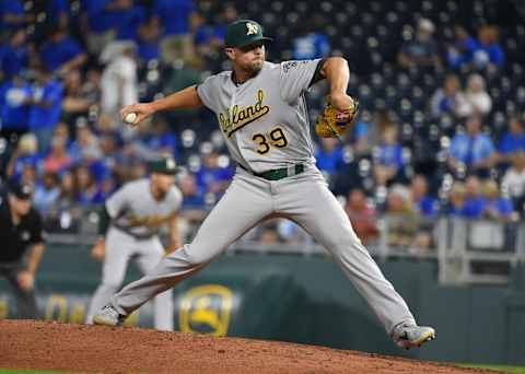 KANSAS CITY, MISSOURI – AUGUST 28: Relief pitcher Blake Treinen #39 of the Oakland Athletics throws in the eighth inning against the Kansas City Royals at Kauffman Stadium on August 28, 2019 in Kansas City, Missouri. (Photo by Ed Zurga/Getty Images)