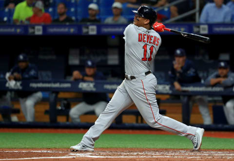 ST PETERSBURG, FLORIDA – SEPTEMBER 23: Rafael Devers #11 of the Boston Red Sox hits an RBI single in the fourth inning during a game against the Tampa Bay Rays at Tropicana Field on September 23, 2019 in St Petersburg, Florida. (Photo by Mike Ehrmann/Getty Images)