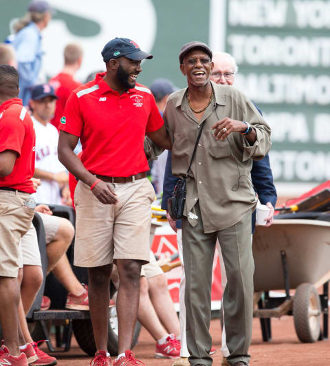 BOSTON, MA – AUGUST 23: Former Boston Red Sox pitcher Dennis “Oil Can” Boyd has a laugh with a member of the grounds staff before a game between the Red Sox and the Kansas City Royals at Fenway Park on August 23, 2015 in Boston, Massachusetts. (Photo by Rich Gagnon/Getty Images)