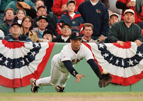 Boston Red Sox third baseman John Valentin makes an unsuccessful dive at a Kenny Lofton foul ball in the eighth inning in the Indians 4-3 victory 02 October at Fenway Park. The Indians are leading the series 2 games to 1. AFP PHOTO Bill POLO (Photo by BILL POLO / AFP) (Photo by BILL POLO/AFP via Getty Images)