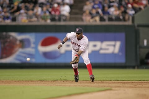 Edgar Renteria of the Boston Red Sox fields a ball against the Kansas City Royals at Kauffman Stadium in Kansas City, Mo. on August 23, 2005. The Red Sox won 5-2. (Photo by G. N. Lowrance/Getty Images)