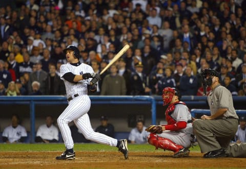 BRONX, NY – OCTOBER 16: Aaron Boone #19 of the New York Yankees hits the game winning home run in the bottom of the eleventh inning against the Boston Red Sox during game 7 of the American League Championship Series on October 16, 2003 at Yankee Stadium in the Bronx, New York. (Photo by Al Bello/Getty Images)