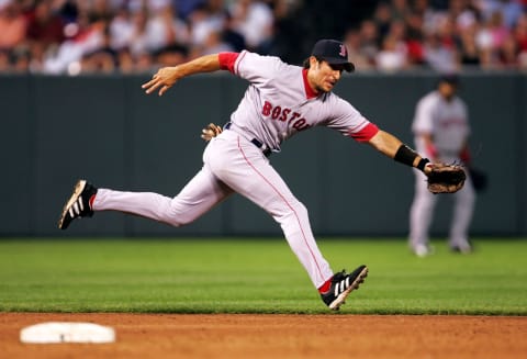 BALTIMORE – JULY 26: Nomar Garciaparra #5 of the Boston Red Sox lunges for a ball during the 3rd inning against the Baltimore Orioles July 26, 2004 at Camden Yards in Baltimore, Maryland. (Photo by Jamie Squire/Getty Images)