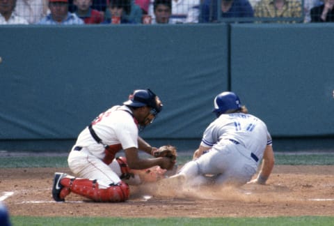 BOSTON, MA – CIRCA 1991: Tony Pena #6 of the Boston Red Sox at home plate tags Kelly Gruber #17 of the Toronto Blue Jays during an Major League Baseball game circa 1991 at Fenway Park in Boston, Massachusetts. Pena played for the Red Sox from 1990-93. (Photo by Focus on Sport/Getty Images)