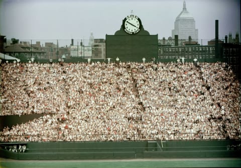 General view of Boston’s Fenway Park, home of the American League baseball team the Boston Red Sox shows the fans packed in the bleachers in the outfield by the Gruen clock, 1960s. Beyond the stadium walls we can see the John Hancock Building at right. (Photo by Hulton Archive/Getty Images)