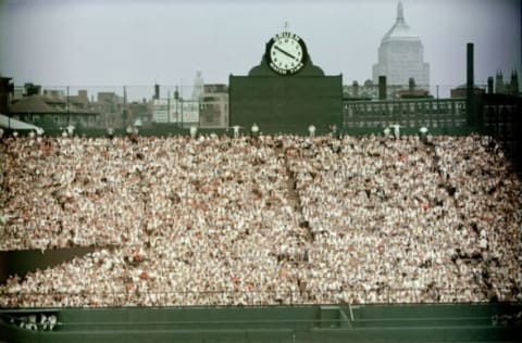 General view of Boston’s Fenway Park, home of the American League baseball team the Boston Red Sox shows the fans packed in the bleachers in the outfield by the Gruen clock, 1960s. Beyond the stadium walls we can see the John Hancock Building at right. (Photo by Hulton Archive/Getty Images)