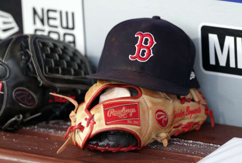 PHILADELPHIA, PA – AUGUST 14: A Rawlings leather baseball glove and a hat sit on the bench in the dugout before a game between the Boston Red Sox and the Philadelphia Phillies at Citizens Bank Park on August 14, 2018 in Philadelphia, Pennsylvania. The Red Sox won 2-1. (Photo by Hunter Martin/Getty Images)