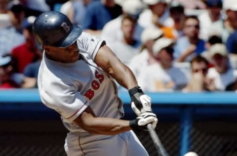 Boston Red Sox outfielder Rickey Henderson hits a solo home run in the top of the third inning against the New York Yankees 2 June 2002 at Yankee Stadium in the Bronx, NY. AFP PHOTO/Matt CAMPBELL (Photo by MATT CAMPBELL / AFP) (Photo by MATT CAMPBELL/AFP via Getty Images)