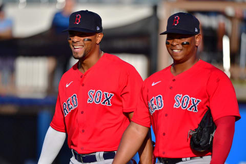 PORT CHARLOTTE, FLORIDA – MARCH 11: Xander Bogaerts #2 and Rafael Devers #11 of the Boston Red Sox share a laugh before a Grapefruit League spring training game against the Tampa Bay Rays at Charlotte Sports Park on March 11, 2020 in Port Charlotte, Florida. (Photo by Julio Aguilar/Getty Images)