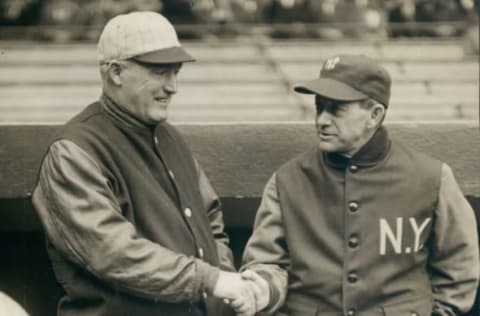 UNSPECIFIED – 1929: New York Yankee manager Miller Huggins shaking hands with Boston Red Sox manager Bill Carrigan. (Sports Studio Photos/Getty Images)