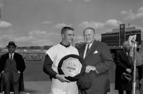 BRONX, NY – 1962: (l to r) Outfielder Roger Maris, of the New York Yankees, is presented with the American league Most Valuable Player trophy for 1961 by American League President Joe Cronin prior to a game at Yankee Stadium in New York in 1962. (Olen Collection/Diamond Images/Getty Images)