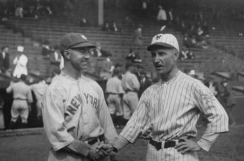 NEW YORK – OCTOBER 12, 1922. Dave Bancroft, captain and shortstop for the New York Yankees, shakes hands with Everett Scott of the New York Giants in the Polo Grounds before game one of the 1924 World Series. (Photo by Mark Rucker/Transcendental Graphics, Getty Images)