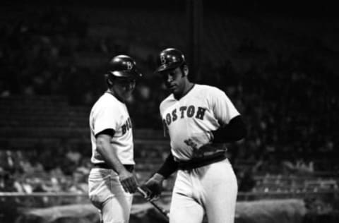 CLEVELAND, OH – APRIL 20, 1973: Designated-hitter Orlando Cepeda #25 (right) of the Boston Red Sox is congratulated at home plate by shortstop Rico Petrocelli #6 (left) after Cepeda hit a solo homerun in the top of the second inning of a game on April 20, 1973 against the Cleveland Indians at Municipal Stadium in Cleveland, Ohio. (Photo by: Ron Kuntz Collection/Diamond Images/Getty Images)