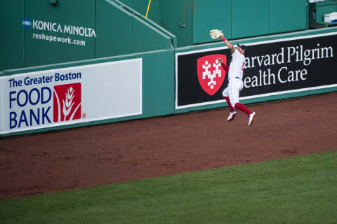 BOSTON, MA – JULY 24: Kevin Pillar #5 of the Boston Red Sox makes a leaping catch in the first inning against the Baltimore Orioles on Opening Day at Fenway Park on July 24, 2020 in Boston, Massachusetts. The 2020 season had been postponed since March due to the COVID-19 pandemic. (Photo by Kathryn Riley/Getty Images)