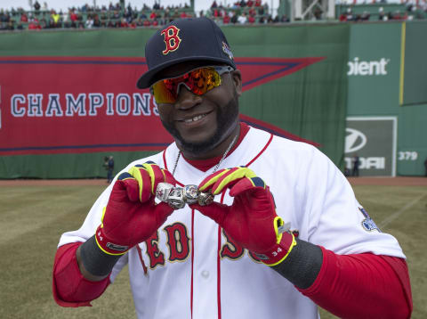 BOSTON, MA – APRIL 4: David Ortiz #34 of the Boston Red Sox shows off his 2004, 2007 and 2013 championship rings along with a ring honoring his 2013 World Series MVP selection during a ceremony honoring the 2013 World Series Champion Boston Red Sox before the start of a game against the Milwaukee Brewers at Fenway Park on April 4, 3014 in Boston, Masschusetts. (Photo by Michael Ivins/Boston Red Sox/Getty Images)