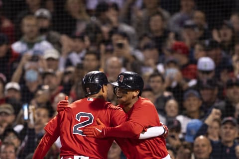 BOSTON, MA – OCTOBER 19: Xander Bogaerts #2 of the Boston Red Sox reacts with Rafael Devers #11 after hitting a go ahead two run home run during the first inning of game four of the 2021 American League Championship Series against the Houston Astros at Fenway Park on October 19, 2021 in Boston, Massachusetts. (Photo by Billie Weiss/Boston Red Sox/Getty Images)