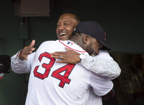 BOSTON, MA – JULY 28: Pedro Martinez hugs his former teammate David Ortiz #34 of the Boston Red Sox before having his number retired during a ceremony at Fenway Park in Boston, Massachusetts on July 28, 2015. (Photo by Michael Ivins/Boston Red Sox/Getty Images)