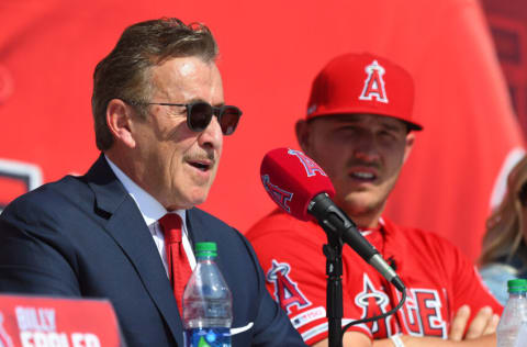 ANAHEIM, CA - MARCH 24: Mike Trout #27 of the Los Angeles Angels of Anaheim looks on as owner Arte Moreno talks during a press conference at Angel Stadium of Anaheim on March 24, 2019 in Anaheim, California. (Photo by Jayne Kamin-Oncea/Getty Images)