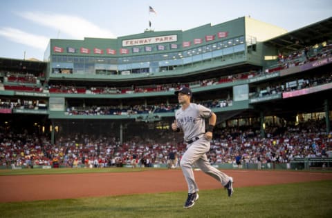 BOSTON, MA - AUGUST 12: Andrew Benintendi #18 of the New York Yankees warms up before a game against the Boston Red Sox on August 12, 2022 at Fenway Park in Boston, Massachusetts.(Photo by Billie Weiss/Boston Red Sox/Getty Images)