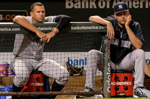 BALTIMORE, MD - SEPTEMBER 11: Alex Rodriguez #13 (L) and Derek Jeter #2 of the New York Yankees look on against the Baltimore Orioles in the ninth inning at Oriole Park at Camden Yards on September 11, 2013 in Baltimore, Maryland.(Photo by Patrick Smith/Getty Images)