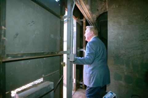 Los Angeles Dodgers Hall of Fame announcer Vin Scully stares out the door of the green monster at Fenway Park in Boston, Massachusetts (Photo by Jon Soohoo/WireImage)