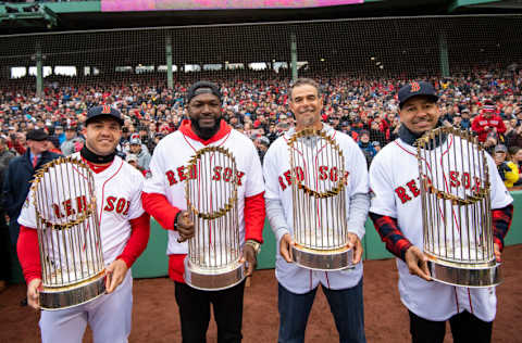 BOSTON, MA - APRIL 9: Steve Pearce #25, former designated hitter David Ortiz, former first baseman Mike Lowell, and former left fielder Manny Ramirez of the Boston Red Sox pose for a photograph with the 2004, 2007, 2013, and 2018 World Series trophies during a 2018 World Series championship ring ceremony before the Opening Day game against the Toronto Blue Jays on April 9, 2019 at Fenway Park in Boston, Massachusetts. All four players won the World Series Most Valuable Player award. (Photo by Billie Weiss/Boston Red Sox/Getty Images)