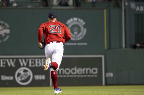 BOSTON, MA - SEPTEMBER 16: Enrique Hernandez of the Boston Red Sox displays the number 21 in recognition of Roberto Clemente during the ninth inning of a game against the Kansas City Royals on September 16, 2022 at Fenway Park in Boston, Massachusetts.(Photo by Billie Weiss/Boston Red Sox/Getty Images)