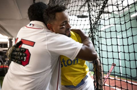 BOSTON, MA - JULY 26: Former Boston Red Sox pitcher Pedro Martinez hugs Xander Bogaerts #2 of the Boston Red Sox in the batting cage ahead of a pre-game ceremony honoring David Ortiz's induction into the Baseball Hall of Fame before a game against the Cleveland Guardians on July 26, 2022 at Fenway Park in Boston, Massachusetts. (Photo by Maddie Malhotra/Boston Red Sox/Getty Images)