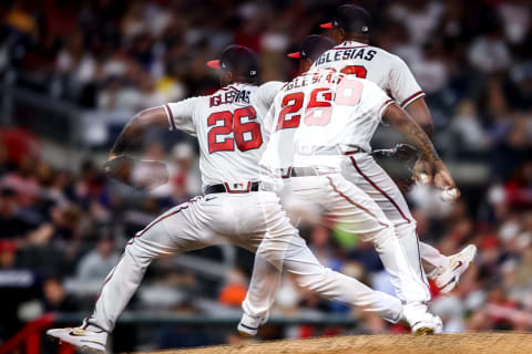 ATLANTA, GA – SEPTEMBER 17: (EDITORS NOTE: This image was created with multiple exposures) Raisel Iglesias #26 of the Atlanta Braves delivers a pitch in the top of the eighth inning of a game against the Philadelphia Phillies at Truist Park on September 17, 2022 in Atlanta, Georgia. (Photo by Casey Sykes/Getty Images)