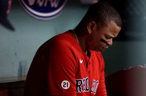 BOSTON, MASSACHUSETTS - SEPTEMBER 16: Rafael Devers #11 of the Boston Red Sox looks on from the dugout during the third inning against the Kansas City Royals at Fenway Park on September 16, 2022 in Boston, Massachusetts. (Photo by Maddie Meyer/Getty Images)