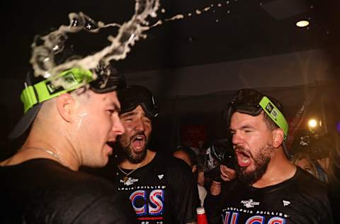 PHILADELPHIA, PENNSYLVANIA - OCTOBER 15: Kyle Schwarber #12 of the Philadelphia Phillies celebrates with teammates in the locker room after defeating the Atlanta Braves to win the National League Division Series at Citizens Bank Park on October 15, 2022 in Philadelphia, Pennsylvania. (Photo by Tim Nwachukwu/Getty Images)