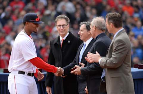 BOSTON, MA - APRIL 4: Xander Bogaerts #2 of the Boston receives a championship ring from Principal Owner John W. Henry and Chairman Tom Werner during a ceremony honoring the 2013 World Series Champion Boston Red Sox before the start of a game against the Milwaukee Brewers at Fenway Park on April 4, 3014 in Boston, Massachusetts. (Photo by Michael Ivins/Boston Red Sox/Getty Images)