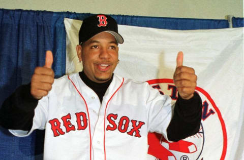 Baseball superstar slugger Manny Ramirez gives the thumbs up after signing a 160 million USD eight year deal with the Boston Red Sox 13 December, 2000 at Fewnway Park in Boston Massachusetts. (FILM) AFP PHOTO/JOHN MOTTERN (Photo by JOHN MOTTERN / AFP) (Photo by JOHN MOTTERN/AFP via Getty Images)