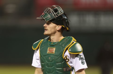 OAKLAND, CALIFORNIA - SEPTEMBER 21: Catcher Sean Murphy #12 of the Oakland Athletics looks on during the game against the Seattle Mariners at RingCentral Coliseum on September 21, 2022 in Oakland, California. (Photo by Lachlan Cunningham/Getty Images)