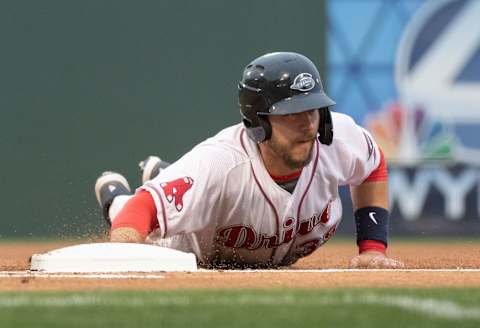 Greenville Drive’s Kole Cottam (39) is safe at first base after a pickoff attempt from West Virginia Power during the game at Flour Field Thursday, April 4, 2019.Ss Drive 04 04 2019 1603