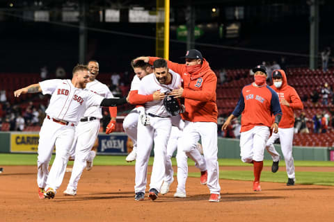 Apr 6, 2021; Boston, Massachusetts, USA; Boston Red Sox left fielder J.D. Martinez (28) celebrates with third baseman Christian Arroyo (39), catcher Kevin Plawecki (25), catcher Christian Vazquez (7), and third baseman Rafael Devers (11) after hitting the game winning two-run RBI double against the Tampa Bay Rays during the 12th inning at Fenway Park. Mandatory Credit: Brian Fluharty-USA TODAY Sports