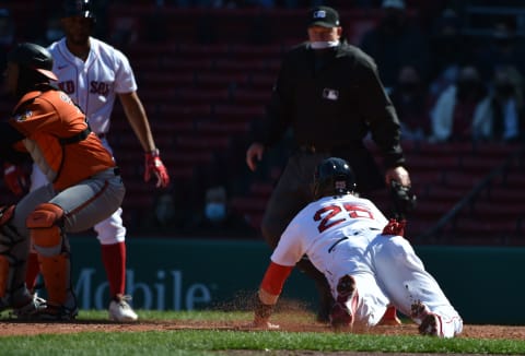 Apr 3, 2021; Boston, Massachusetts, USA; Boston Red Sox catcher Kevin Plawecki (25) reaches home plate for a run during the fifth inning against the Baltimore Orioles at Fenway Park. Mandatory Credit: Bob DeChiara-USA TODAY Sports