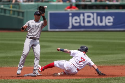 Jun 27, 2021; Boston, Massachusetts, USA; Boston Red Sox catcher Christian Vazquez (7) slides into second base during the first inning against the New York Yankees at Fenway Park. Mandatory Credit: Paul Rutherford-USA TODAY Sports