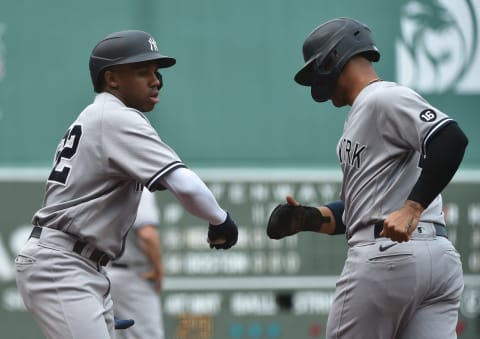 Jul 25, 2021; Boston, Massachusetts, USA; New York Yankees shortstop Gleyber Torres (25) is congratulated by right fielder Greg Allen (22) after scoring a run during the fourth inning against the Boston Red Sox at Fenway Park. Mandatory Credit: Bob DeChiara-USA TODAY Sports