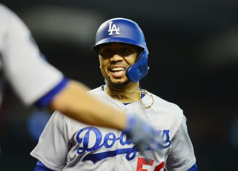 Aug 1, 2021; Phoenix, Arizona, USA; Los Angeles Dodgers second baseman Mookie Betts (50) celebrates his solo home run against the Arizona Diamondbacks during the ninth inning at Chase Field. Mandatory Credit: Gary A. Vasquez-USA TODAY Sports